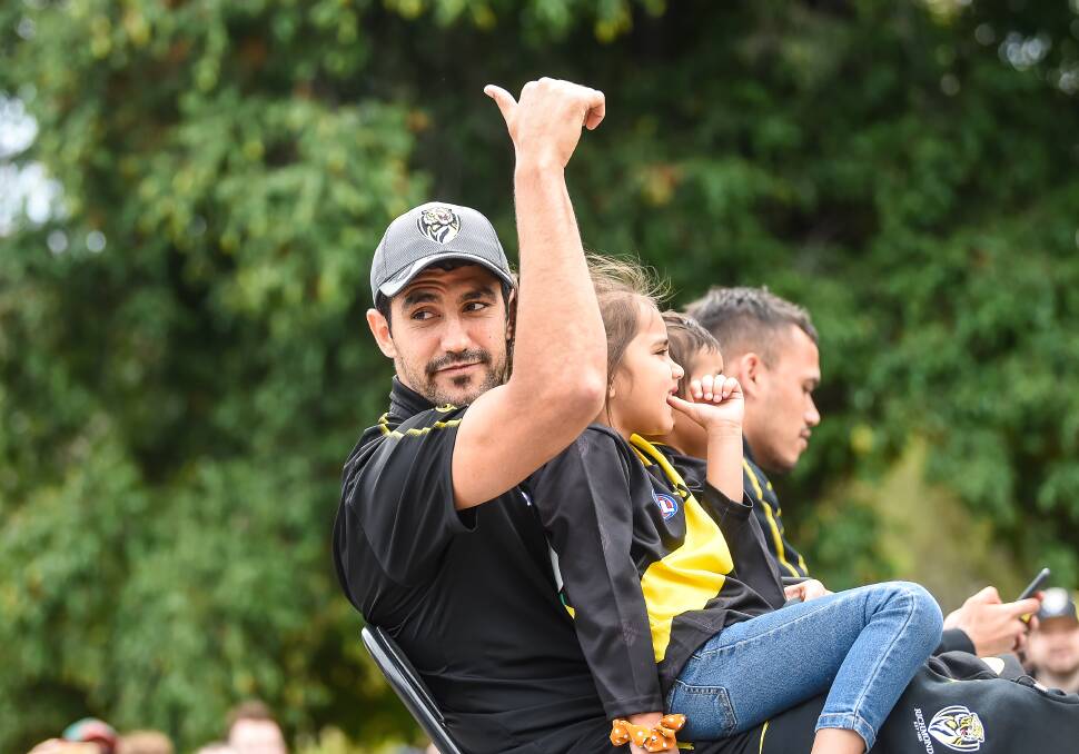 SHOCK OR NOT: Tiger Marlion Pickett gives the thumbs up during the players parade a day before his AFL debut, called up to play a role in the grand final. Picture: The Age