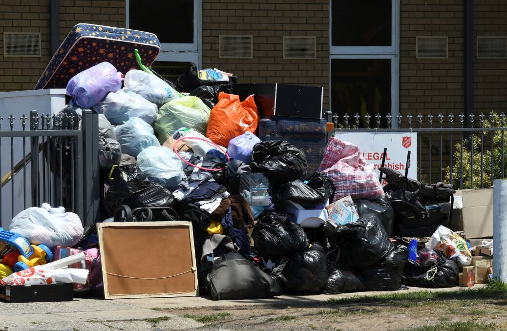 PUTRID: The scene outside the Salvo's Store in Norman Street Wendouree on Sunday afternoon after dozens of bags were dumped out the front. Picture: Lachlan Bence