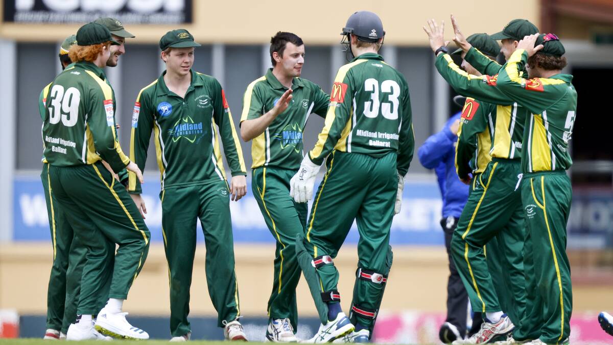 Ballarat-Redan players celebrate one of their three wickets against Golden Point. Picture: Luke Hemer