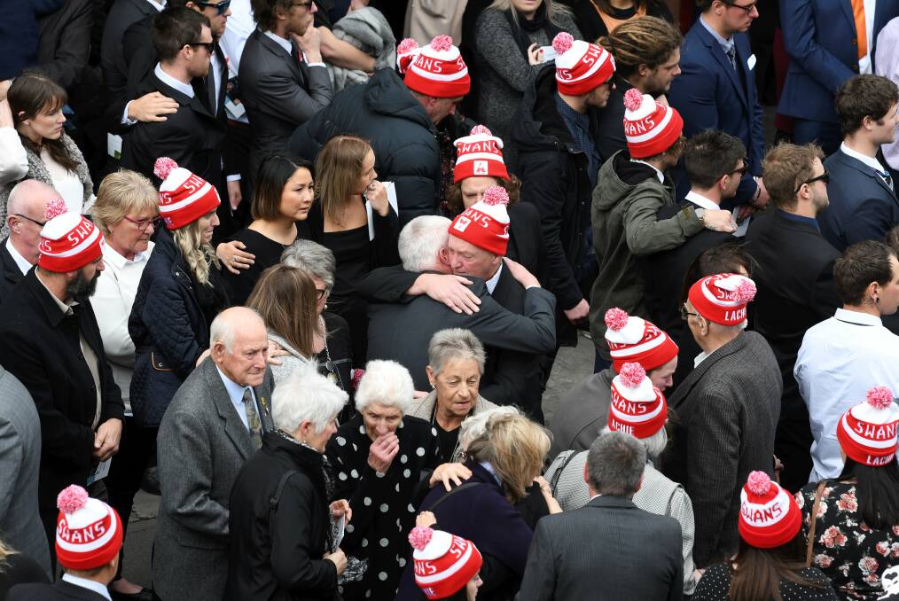 Mourners, including dozens wearing Sydney Swans beanies paid respect to Lachie Poulter at his funeral at the Mining Exchange. Picture: Lachlan Bence
