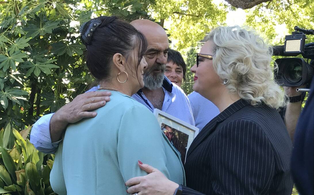 Janine and Dave Brownlee embraced by Attorney General Jill Hennessy at the announcement of the new Industrial Manslaughter bill on Tuesday. Their son Jack died in a workplace incident in March last year. Picture: Charlotte Grieve