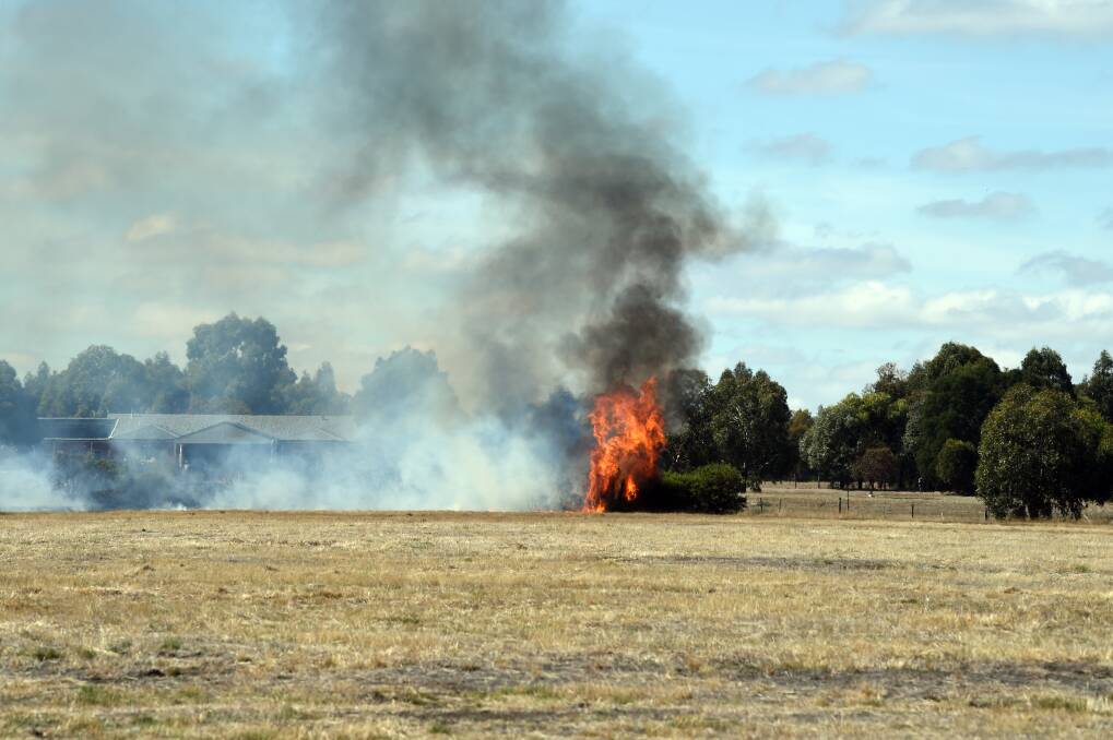 A fire which took hold in grass land near Cardigan on Thursday. Picture: Kate Healy