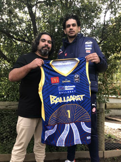 Artist Jayden Lillyst and Miners player William Hickey unveil the jersey both Ballarat teams will wear on Saturday night for Indigenous Round. Picture: Greg Gliddon