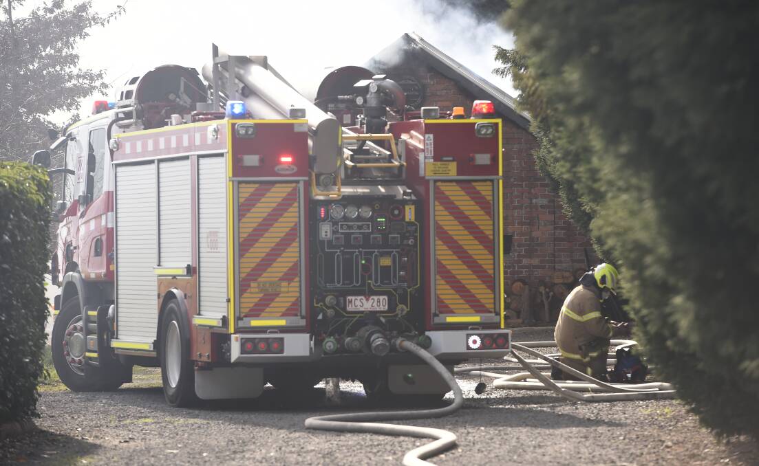 Fire crews on the scene of a blaze at a shed at the rear of an Invermay property. Picture: Adam Trafford