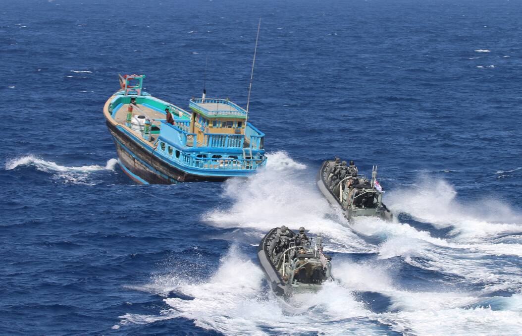 HMAS Ballarat's boarding party close on a suspicious dhow for a boarding which resulted in the seizure of approximately two and a half tonnes of illicit drugs. Picture: Australian Defence Force
