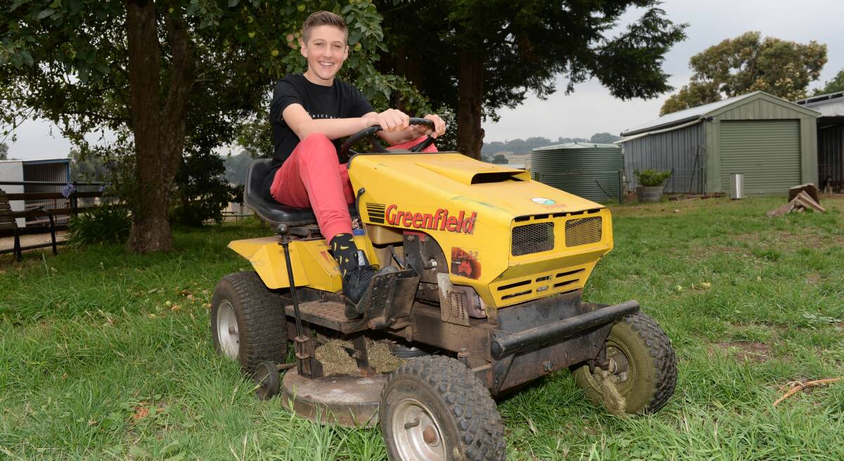 BUSINESS MAN: Nathan Carpenter has started a lawn mowing business to fund a school trip to NASA. Picture: Kate Healy