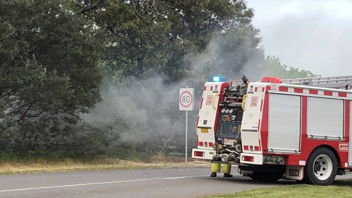 smoke billowed from the scene of the crash. Picture: Greg Gliddon
