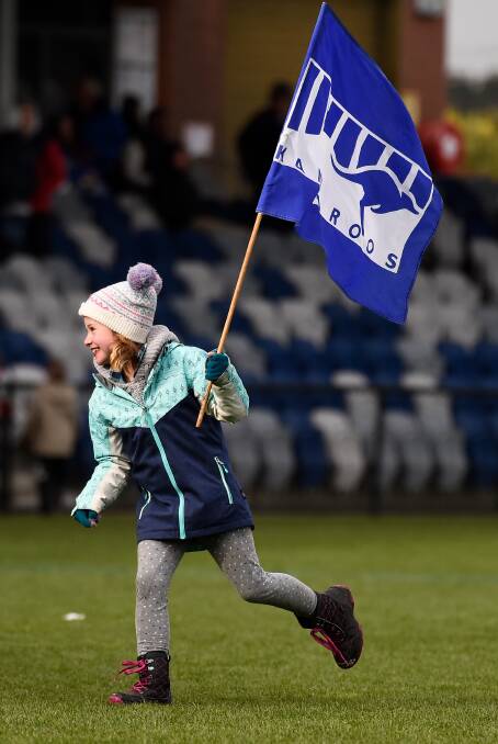 FLY THE FLAG: Waubra fan Victoria made sure she was noticed as she cheered on her side. Picture: Adam Trafford