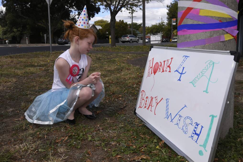 Amity-Mabel has come up with a novel way to celebrate her birthday today asking cars to honk as they go by her home in Redan. Picture: Lachlan Bence