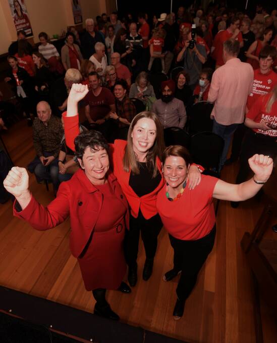 Labor's candidates celebrate with the crowd at Trades Hall. Picture by Lachlan Bence