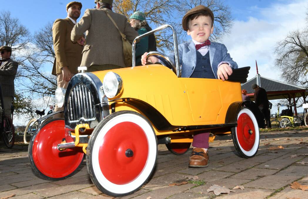 Three-year-old Revben Depperler had his own set of wheels for the Tweed Ride