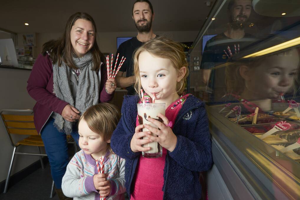 Nicole Elliott from No Waste Ballarat with Michael Litrus from Burger Brothers and Chookas and Eliza Jane and Annabella try out the papaer straws. Picture: Luka Kauzlaric