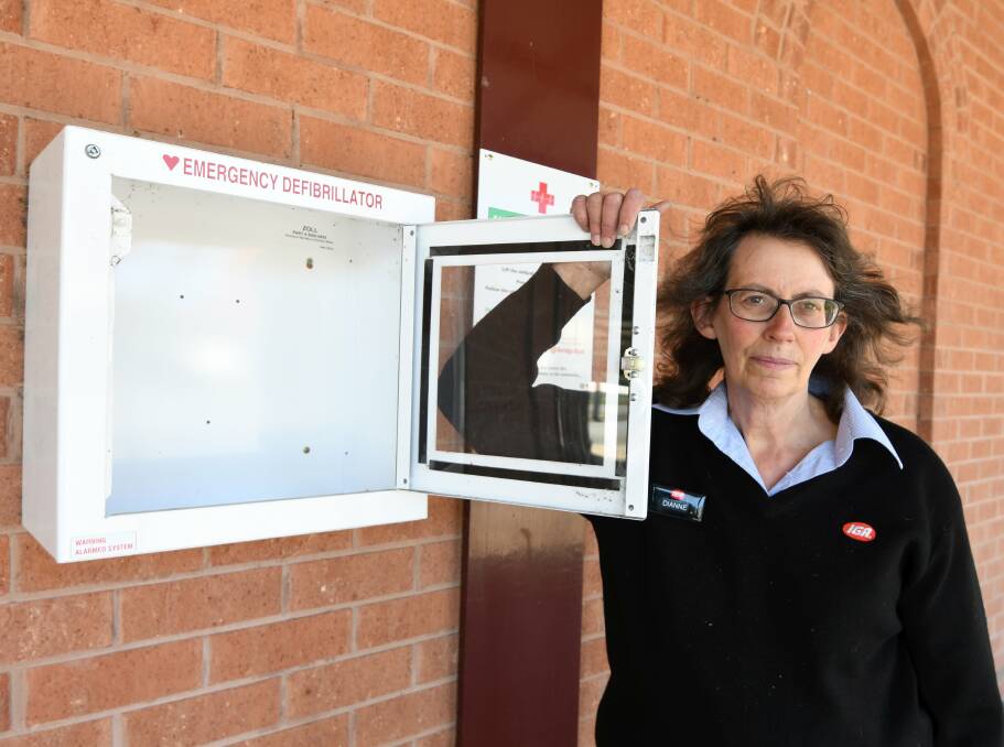 EMPTY: Owner-Manager of Clune IGA Dianne Hill at the box where the defibrillator was kept. Picture: Lachlan Bence