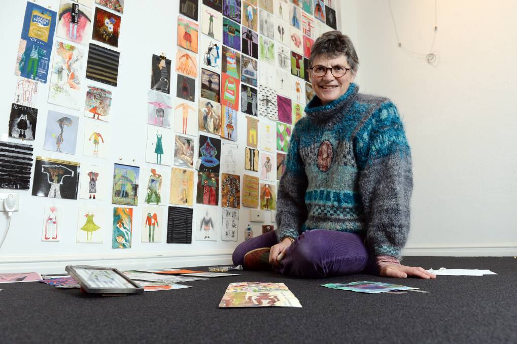 DESIGNING WOMAN: Artist Maryanne Coutts with some of her artwork which she has completed every day for the past five years. Picture: Kate Healy