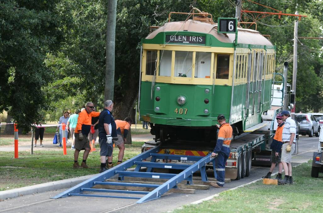 The tram is lowered onto the track at Lake Wendouree on Friday morning. Picture: Lachlan Bence
