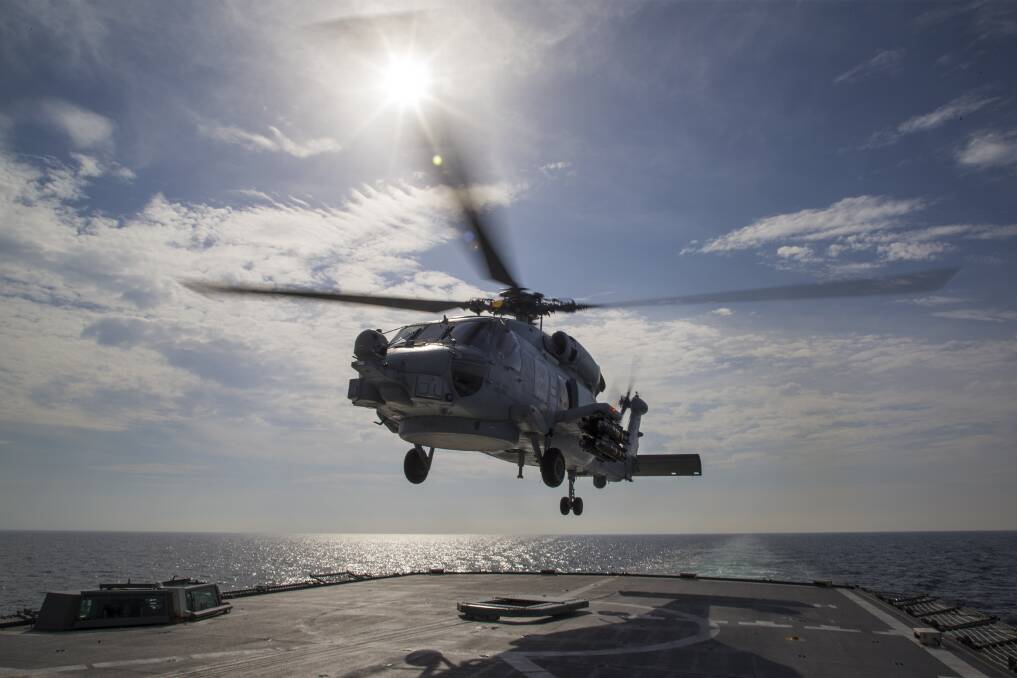 A helicopter lands on the ship. Picture: Australian Defence Force