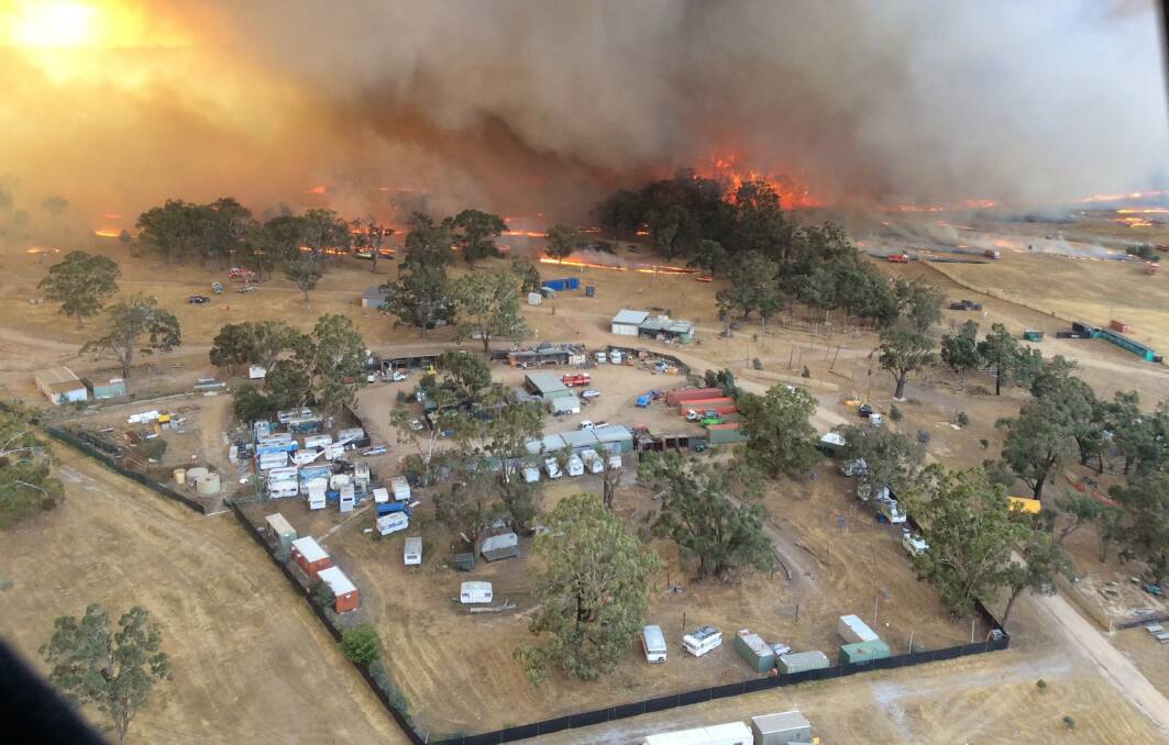 The busfire in December came perilously close to the township, ripping through the nearby Rainbow Serpent site. Picture: Wayne Rigg