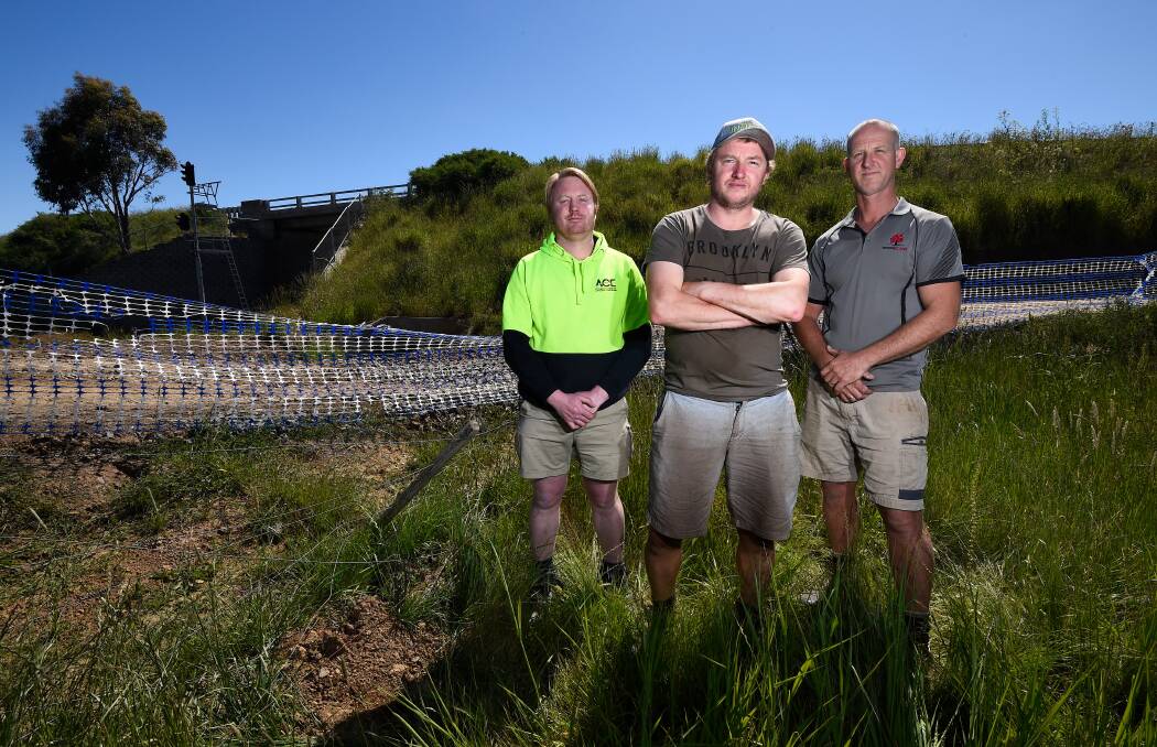 Farmers Adam Ludbrook, James Downey and David Trigg are concerned about the mess being left behind on their properties due to the construction of the Ballarat line upgrade. Picture" Adam Trafford 