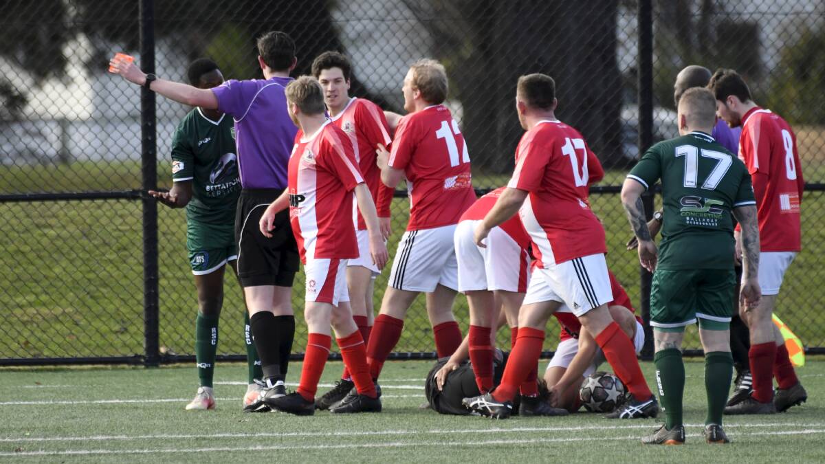 RED CARD: Ballarat SC players remonstrate after their goal keeper was injured during the BDSA senior match against Forest Ranges on Sunday. Picture: Lachlan Bence