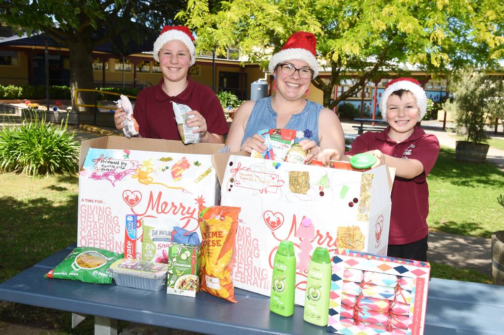 Tlarnee 10, Jacquie Yole and Payton, 8 are taking part in the Reverse Advent Calendar initiative throughout December. Picture: Kate Healy