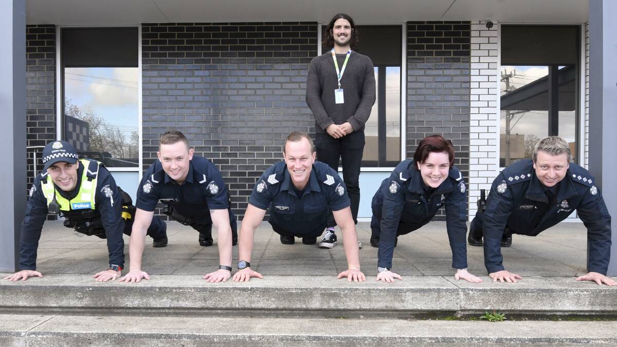 HEALTH: Police members Pat Cincotta, Steven Tung, Pieter Haans, Emma Grantham and Dan Davison with Oliver Love-Davies from headspace. Picture: Lachlan Bence