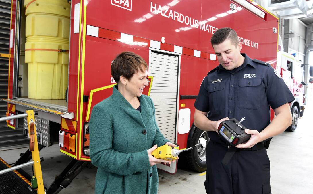 Regional Development Minister Jaala Pulford and Lucas firefighter Lachlan Butterfield in front of the new HAZMAT truck. Picture: Lachlan Bence