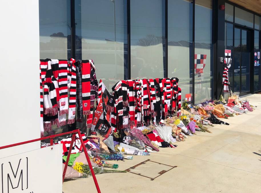 A shrine of Saints scarves and flowers at the entrance to Moorabbin Oval. Picture: Greg Gliddon