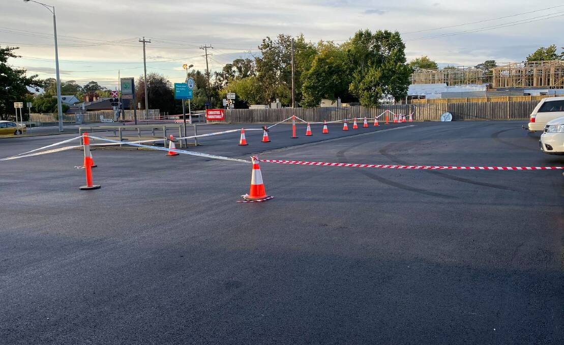 Surely this could have waited! Car park resurfacing closed off deliveries to Woolworths in Wendouree this morning. Picture: Hayley Elg