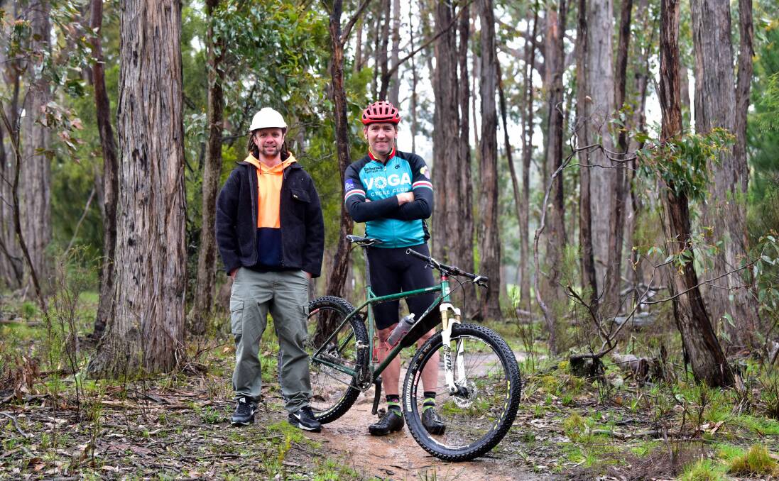 Mick McCallum (Hepburn Shire Council Construction Manager for Creswick Trails Project) and VOGA committee member Mick Veal in bushland near Creswick. Picture: Brendan McCarthy