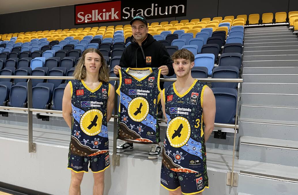 Ballarat Miners players Will Hynes and Zac Dunmore model the NAIDOC Week jersey they will wear with artist Billy-Jay O'Toole. Picture: Greg Gliddon