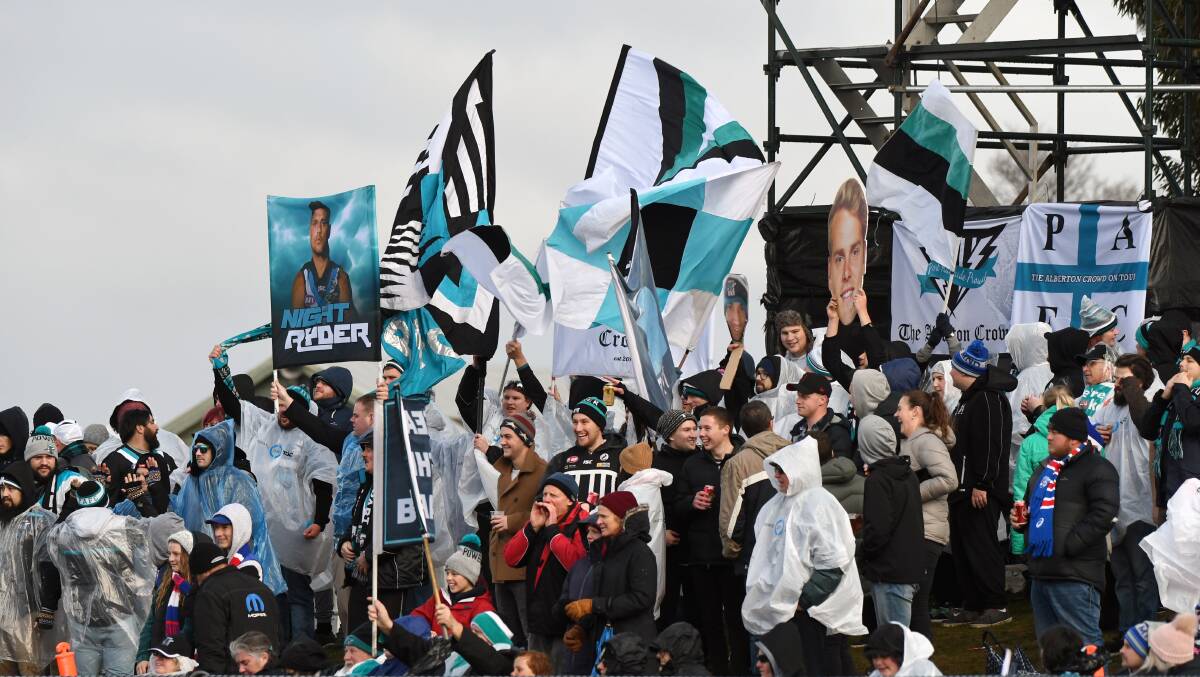 Port Adelaide fans were in fine form as their team ran away to a big win at Mars Stadium on Sunday night. Picture: Kate Healy