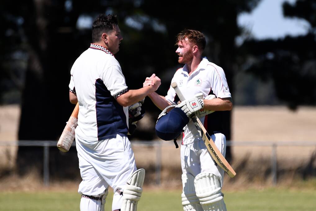 Justin O'Brien and Marshall Cain congratulate each other after a stunning partnership. Picture: Adam Trafford