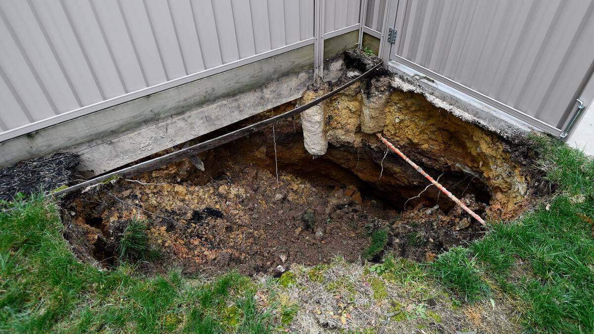 The mine shaft collapse caused a hole three metres by two metres to appear in this Brown Hill backyard. Picture: Adam Trafford