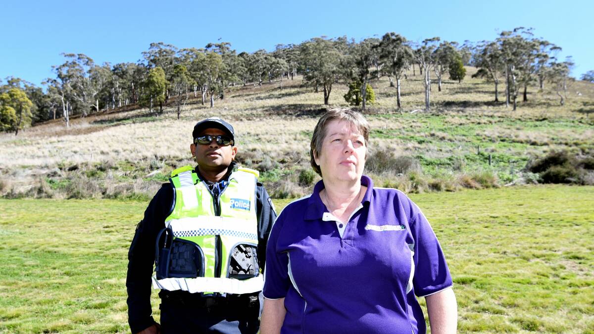 Senior Constable Sean Almeida and property owner Coral Loader at the base of Mount Buninyong where the tyres rolled down. Picture: Lachlan Bence