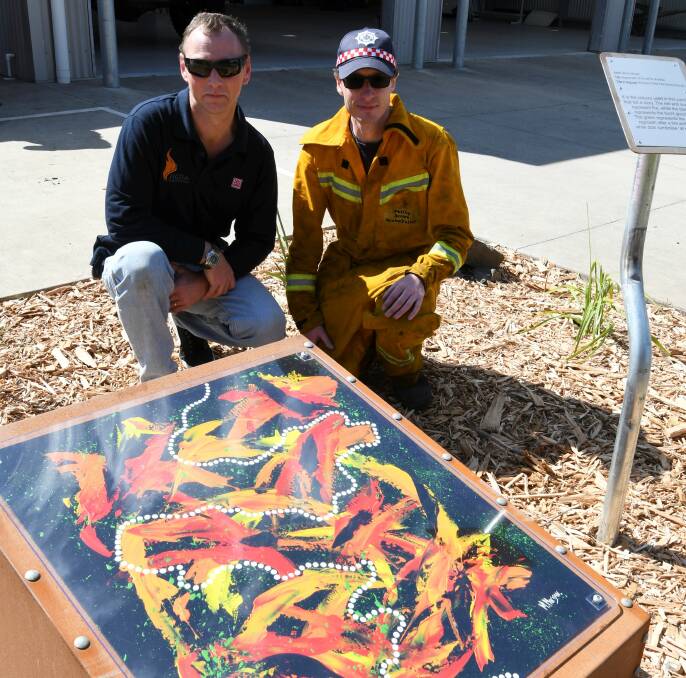 Captain Anthony Baker and 1st Lieutenant Phillip Brown unveil the new artwork at Snake Valley. Picture: Lachlan Bence
