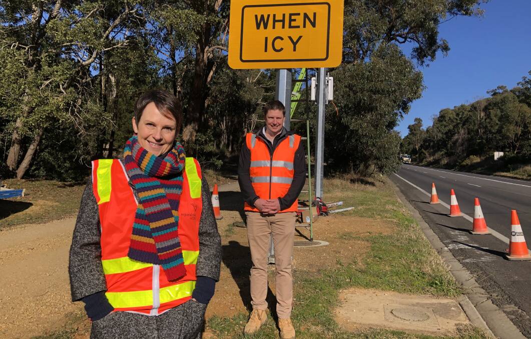 Roads and TAC Minister Jaala Pulford with Regional Roads Victoria's Michael Bailey at the position of the new electronic black ice warning signs. Picture: Greg Gliddon