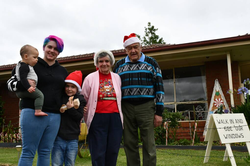 CHRISTMAS SPIRIT: Tzara Brooker with children Lynkin and Zayne and Valerie and Graeme Harris at their Miner's Rest home. Pitcure: Alex Ford 