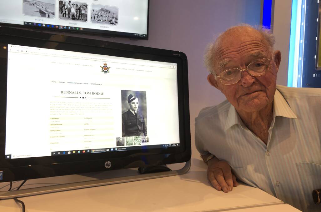 World War II veteran, 95-year-old Tom Runnalls, looks up his own page on the new 1WAGS page at the website launch. Picture: Greg Gliddon