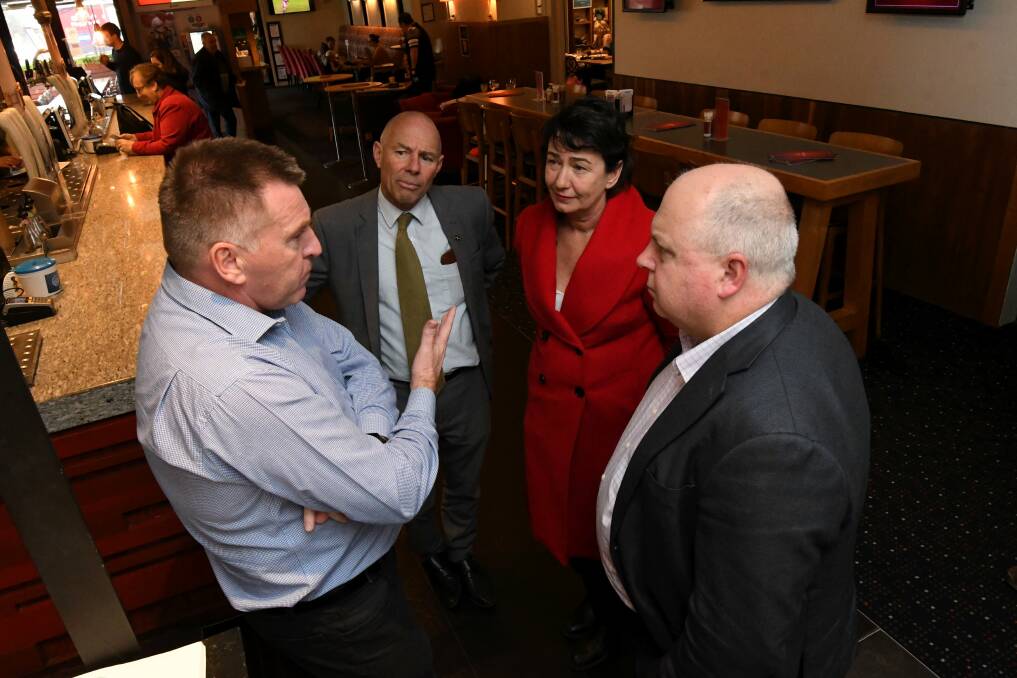 David Canny owner Red Lion, Buninyong MP Geoff Howard, Labor candidate Michaela Settle and Treasurer Tim Pallas sees how cuts to payroll tax are helping regional businesses. Picture: Lachlan Bence