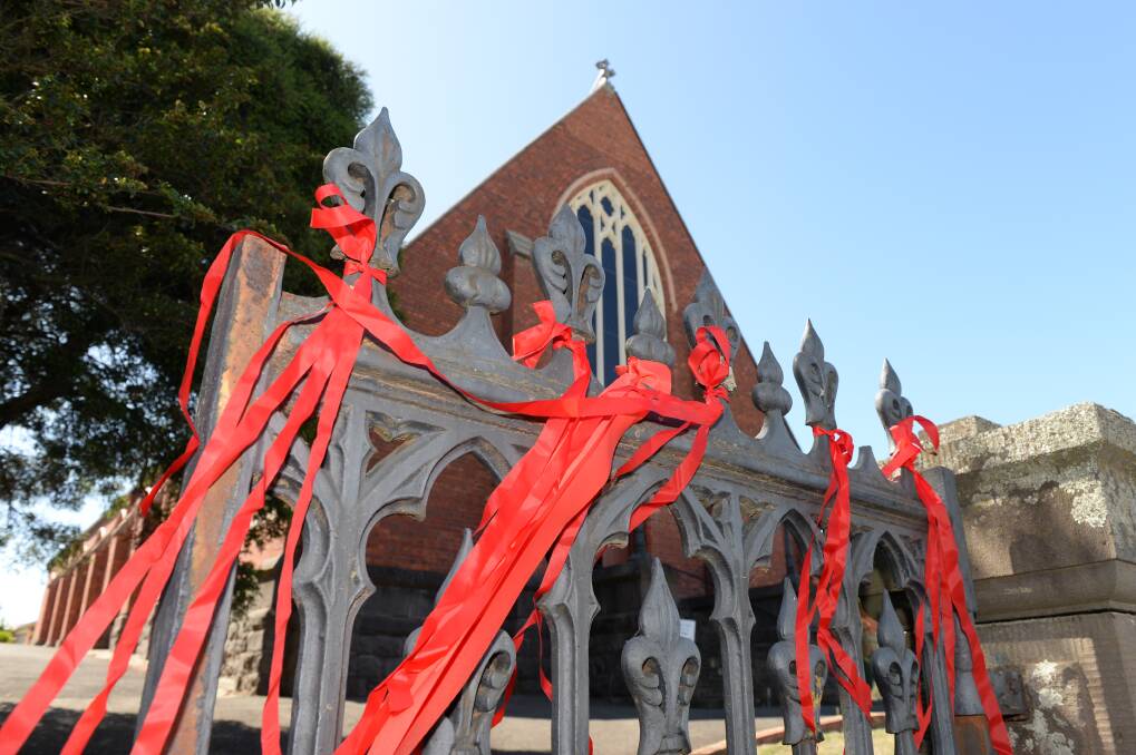 RAW: The fence outside St Paul's Anglican church is now adorned with ribbons after it was stripped bare last week. Picture: Kate Healy