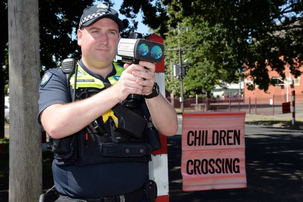 Acting Sergeant Jeremy Hancock of the Ballarat Highway Patrol reminding people that 40km/h school zones are now back in action. Picture: Kate Healy