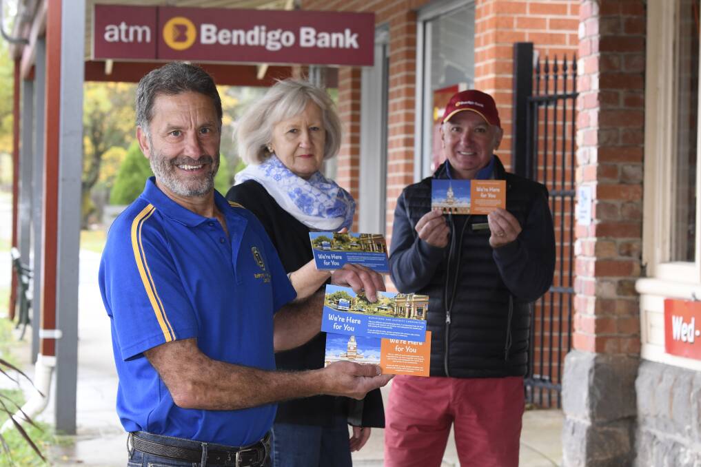 KINDNESS CARDS: David Page, Gayle Adams, Chair - Buninyong & District Community Associtation and Ian Corcoran with the cards that are being delivered across Buninyong and Mount Helen. Picture: Lachlan Bence