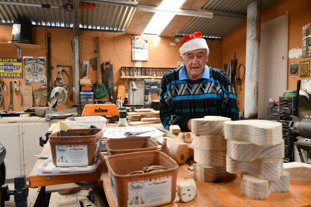 Mr Harris spends much of his days making more than 800 toys to give to children each Christmas. Picture: Alex Ford.