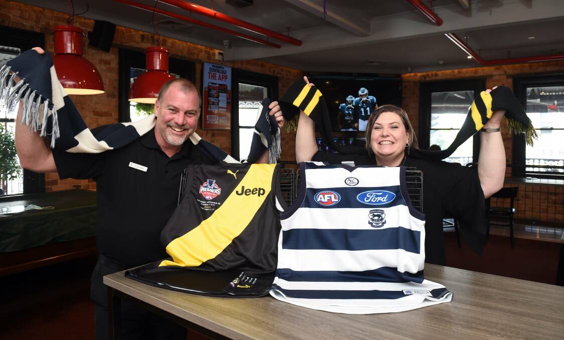 GAME ON: Clayton O'Callaghan (venue manager) and Anne Alexander (franchisee) from Sporting Globe are preparing for their biggest weekend in months just in time for the AFL Grand Final. Picture: Kate Healy