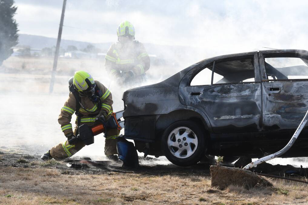 Fire crews are investigating another burned out car like this one in Mitchell Park on Saturday. Picture: Lachlan Bence