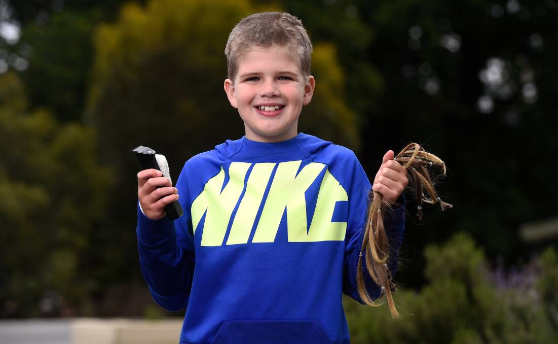 Fletch Martin grew his hair for two-and-a-half years to make a wig for a child with alopecia. Picture: Adam Trafford
