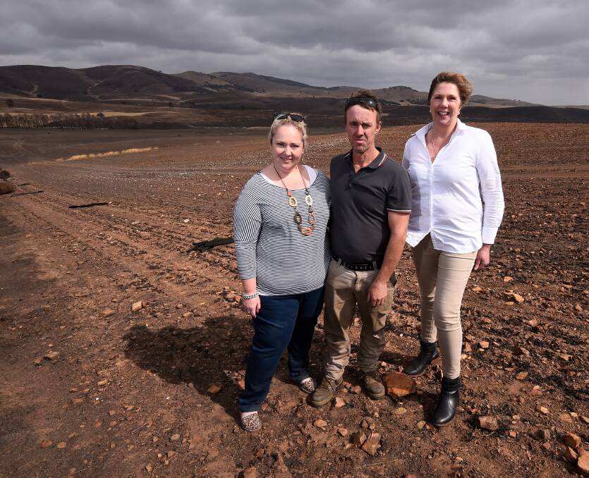 REMAINS: Rebecca and Rod McErvale show Ballarat MP Catherine King around their scorched property almost a month after the blaze. Picture: Adam Trafford.