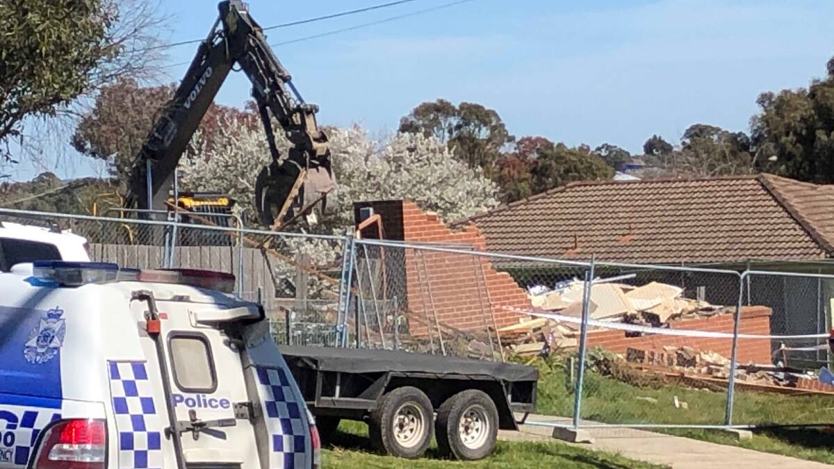 KILLED AT WORK: Police at the scene of a wall collapse that killed a 56-year-old man in Kenworthy Place Mount Pleasant on Wednesday. Picture: Greg Gliddon