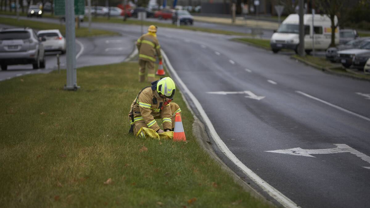 CFA crews are shutting a south bound lane on Creswick Road as crews work to clean up an oil slick. Picture: Luka Kauzlaric