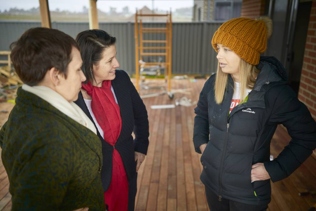First homeowner Kristy Begbie speaks with Minister for Regional Development Jaala Pulford and Wendouree candidate Juliana Addison. Picture: Luka Kauzlaric